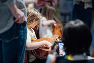 Girl playing the Lute at the Bate Collection of Musical Instruments