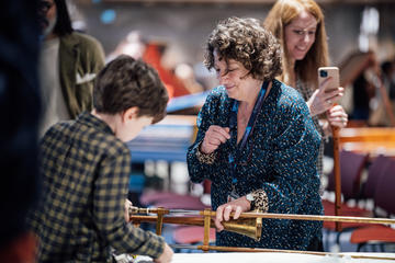 Boy looking at instrument at the Bate Collection of Musical Instruments