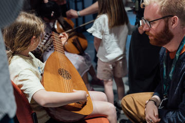 Girl playing the Lute at the Bate Collection of Musical Instruments