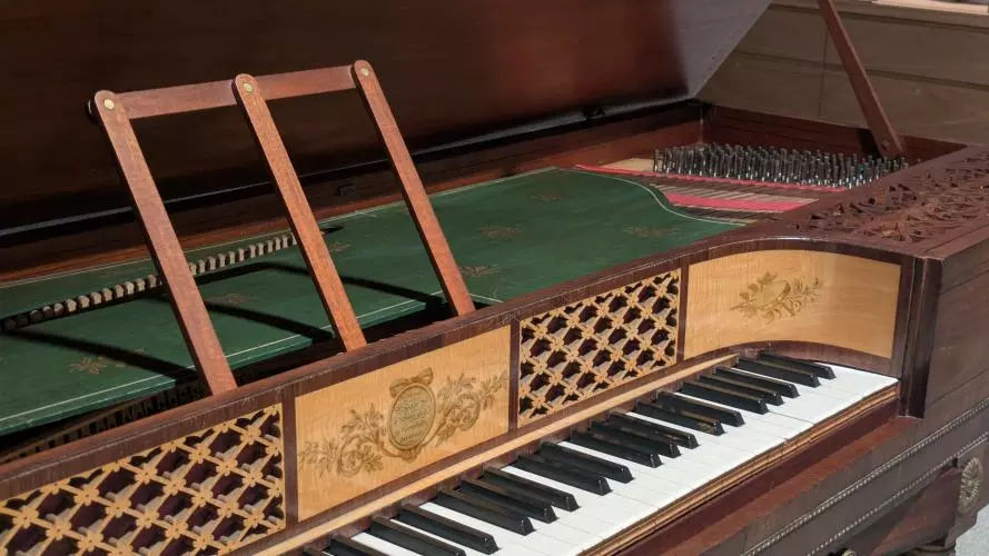 Early 19th-century square piano by Astor & Horwood, featuring satinwood veneer and silk-lined fretwork panels